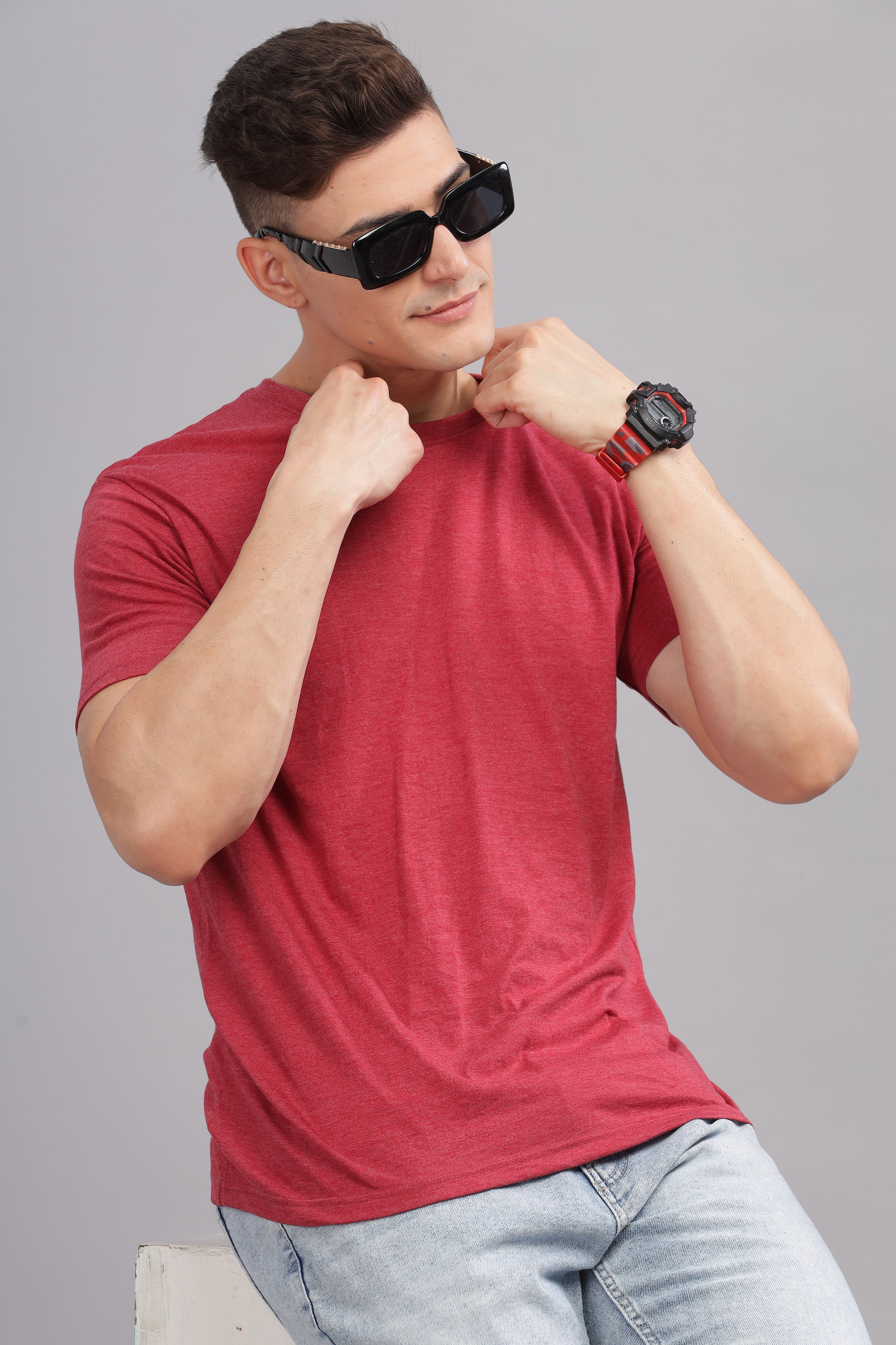Man wearing a red cotton t-shirt and sunglasses showcasing Soulmonk's All Products streetwear collection