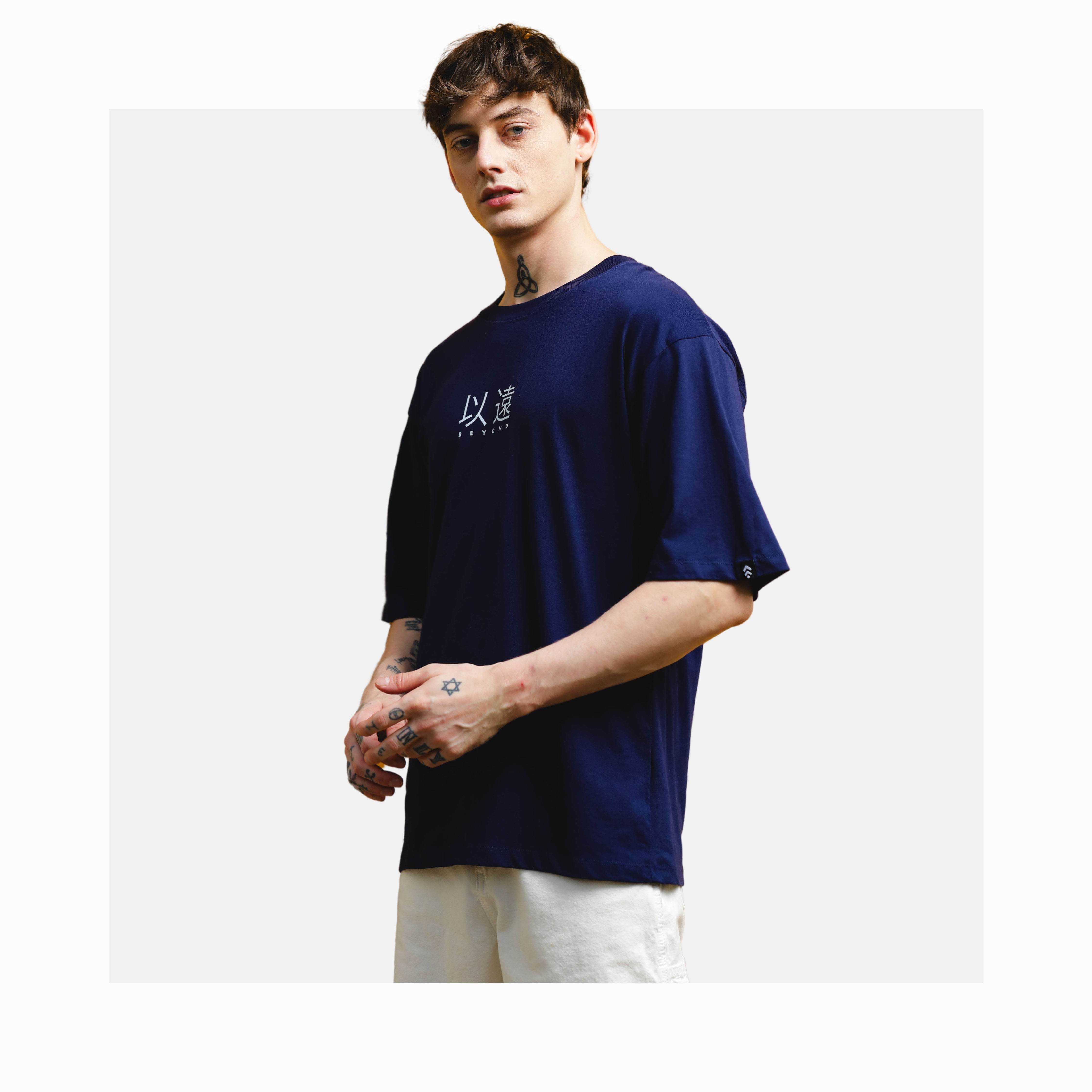 Man wearing navy oversized t-shirt from men's premium comfortwear collection by Soulmonk