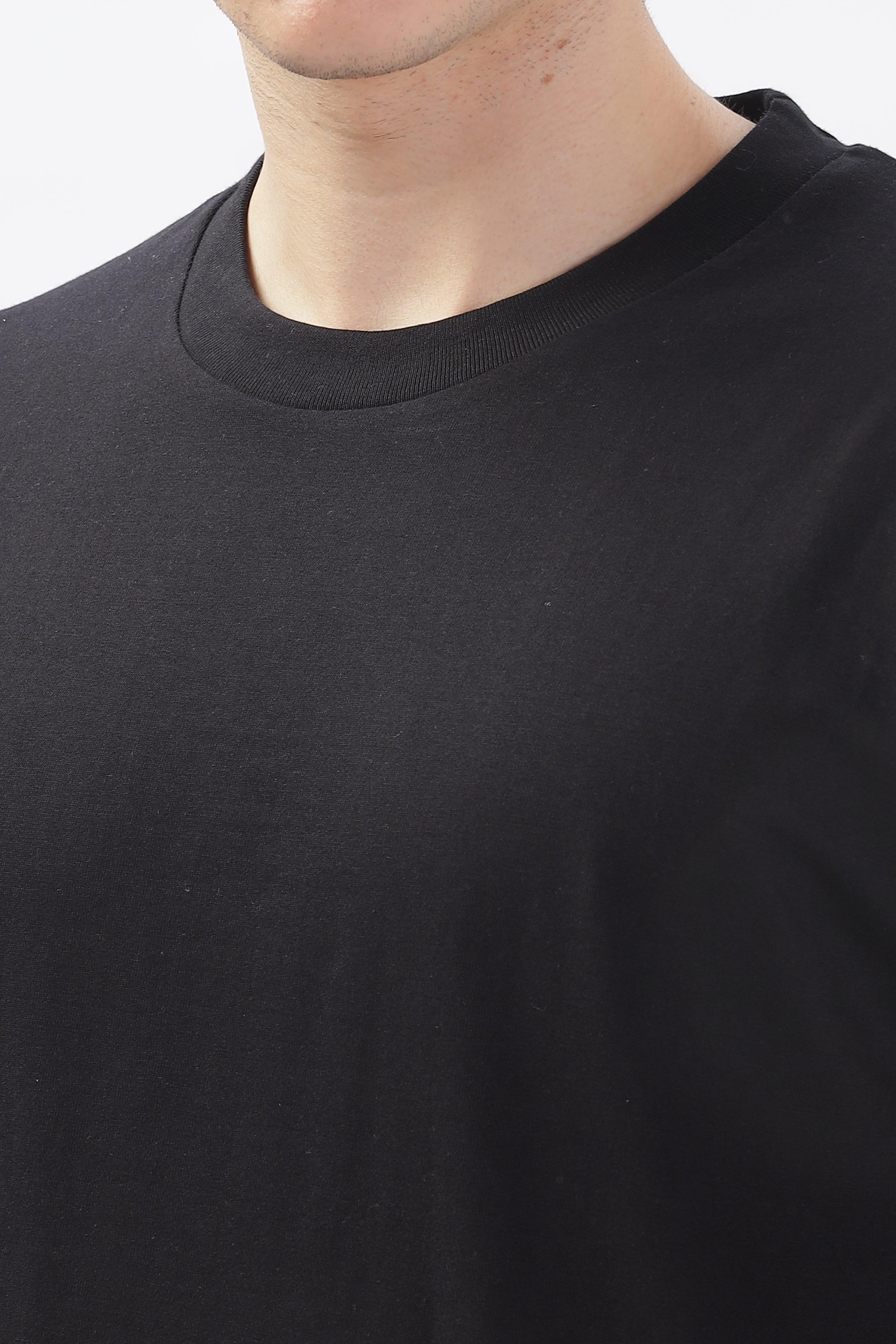 Close-up of a black oversized t-shirt for men by Soulmonk featuring a round neckline
