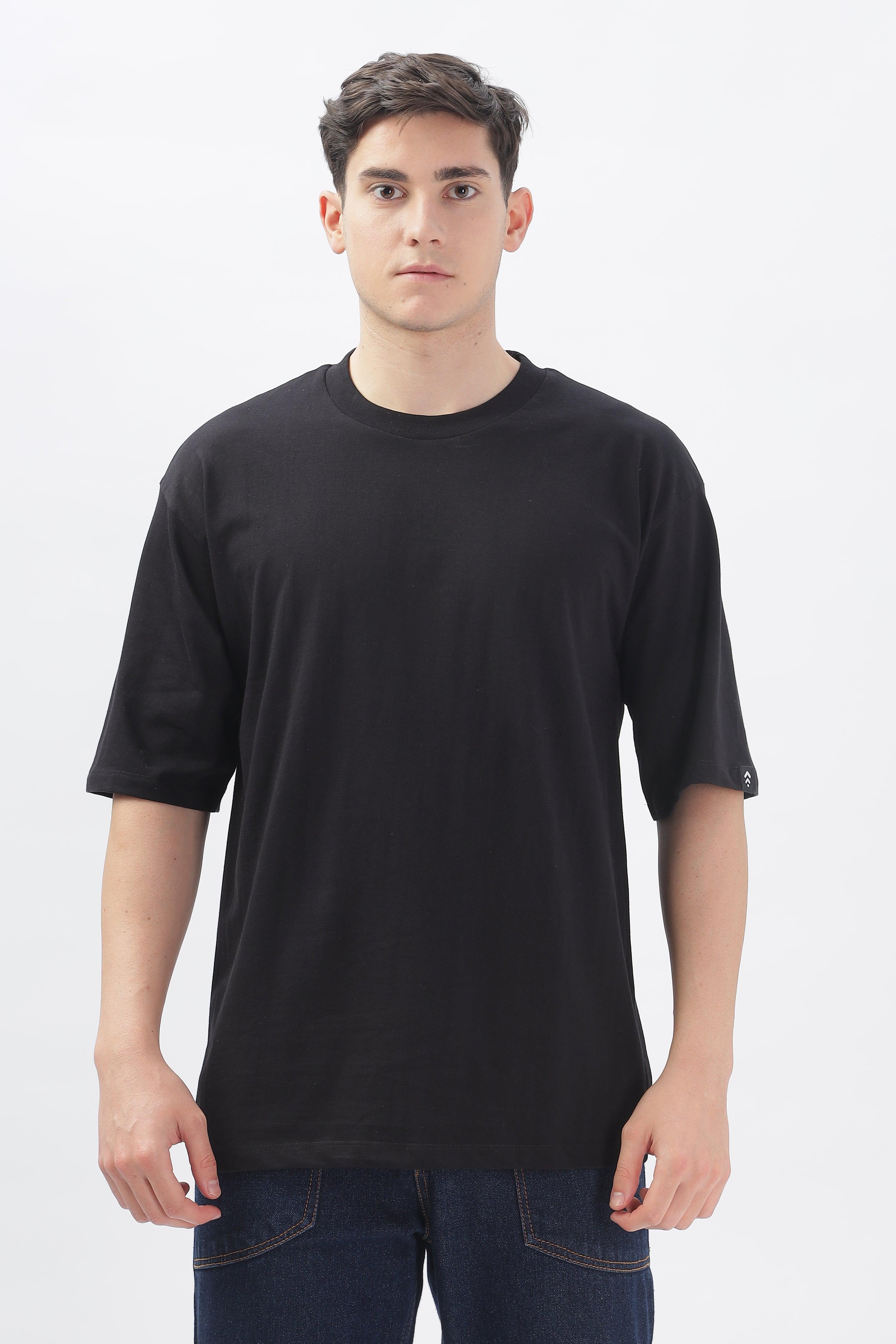 Soulmonk black oversized t-shirt for men worn by male model with short sleeves and relaxed fit