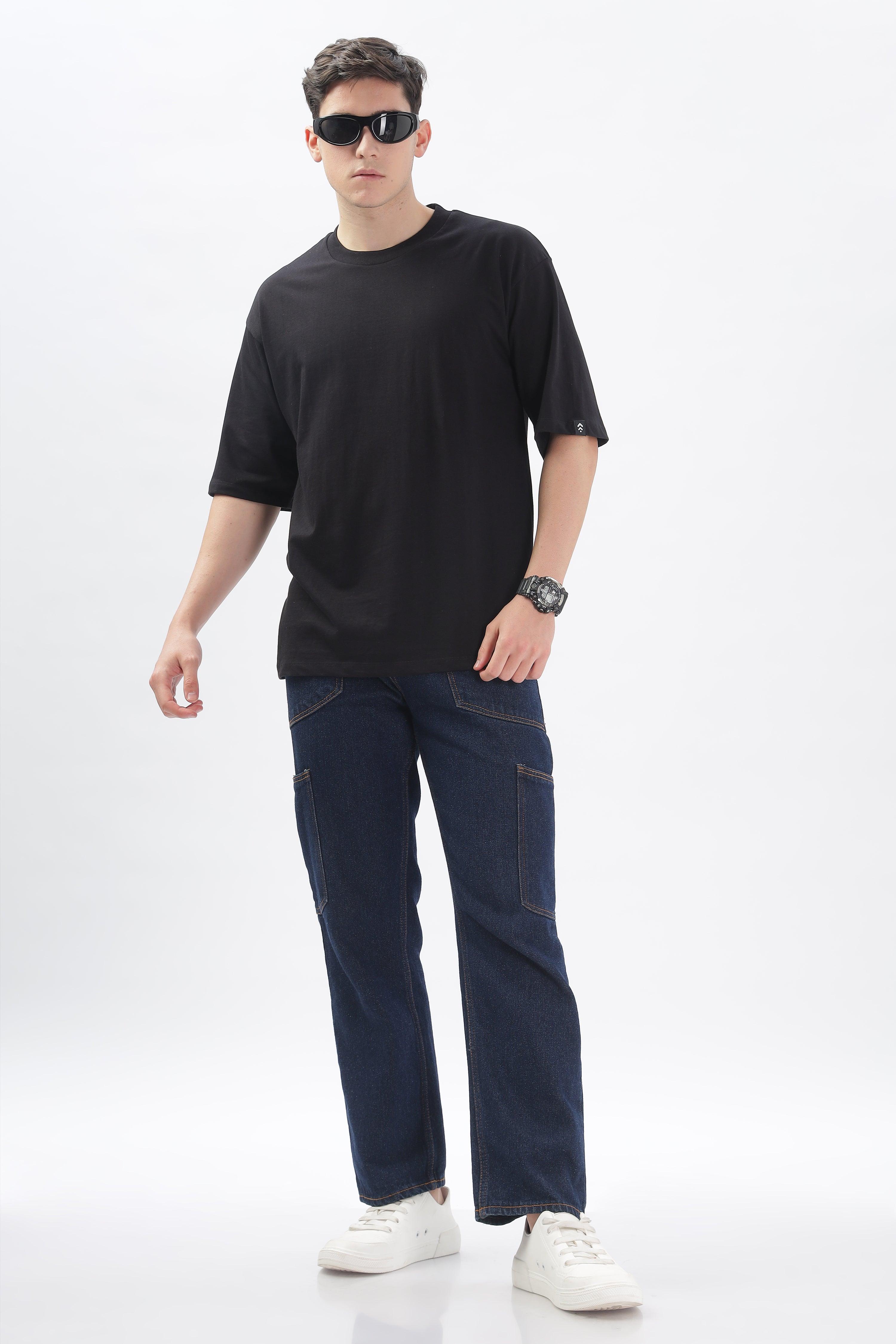 Soulmonk black oversized t-shirt for men worn with casual dark jeans and white sneakers