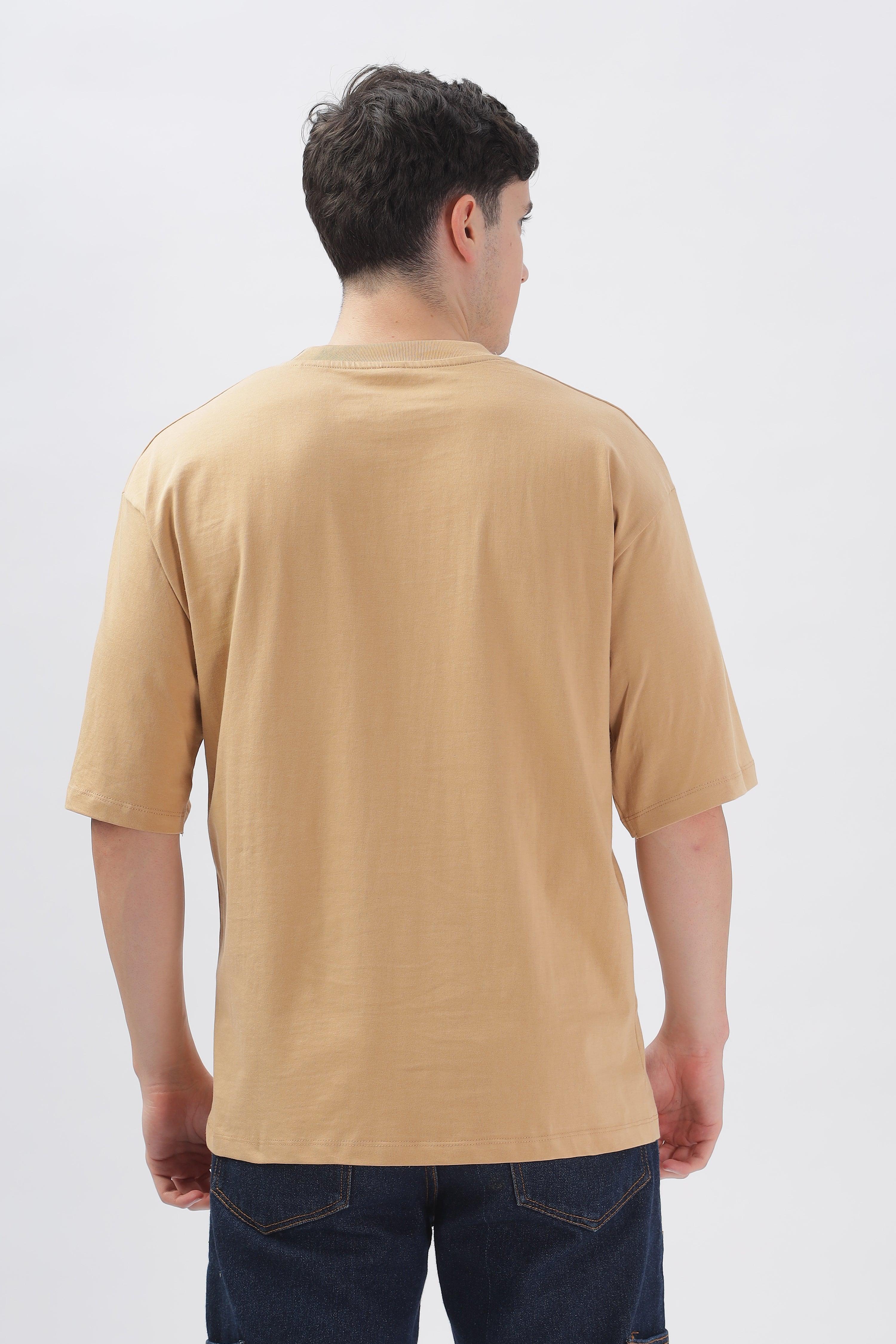 Back view of male model wearing Soulmonk taupe oversized t-shirt with half sleeves and relaxed fit
