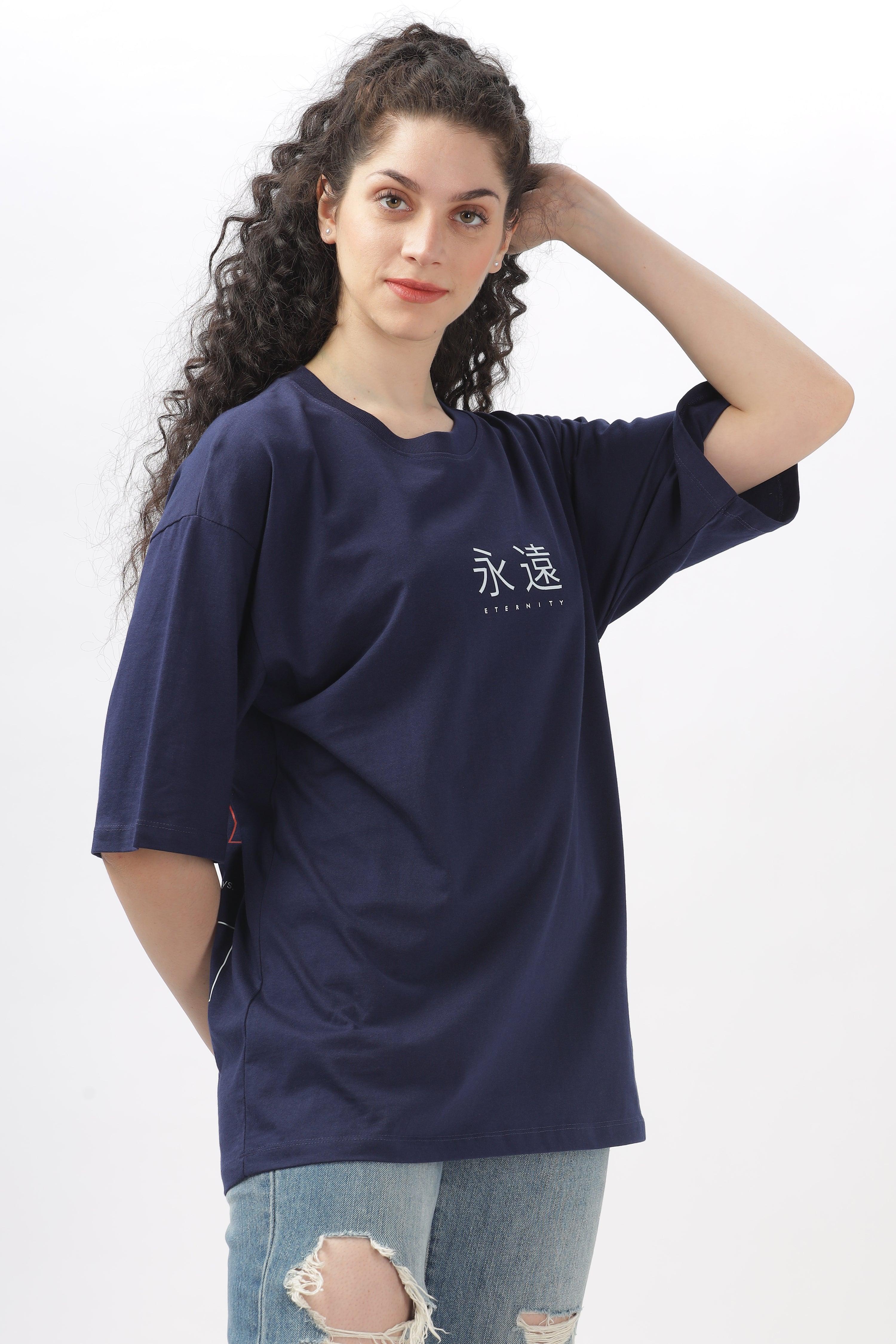 Soulmonk navy blue oversized t-shirt worn by woman with curly hair paired with ripped jeans
