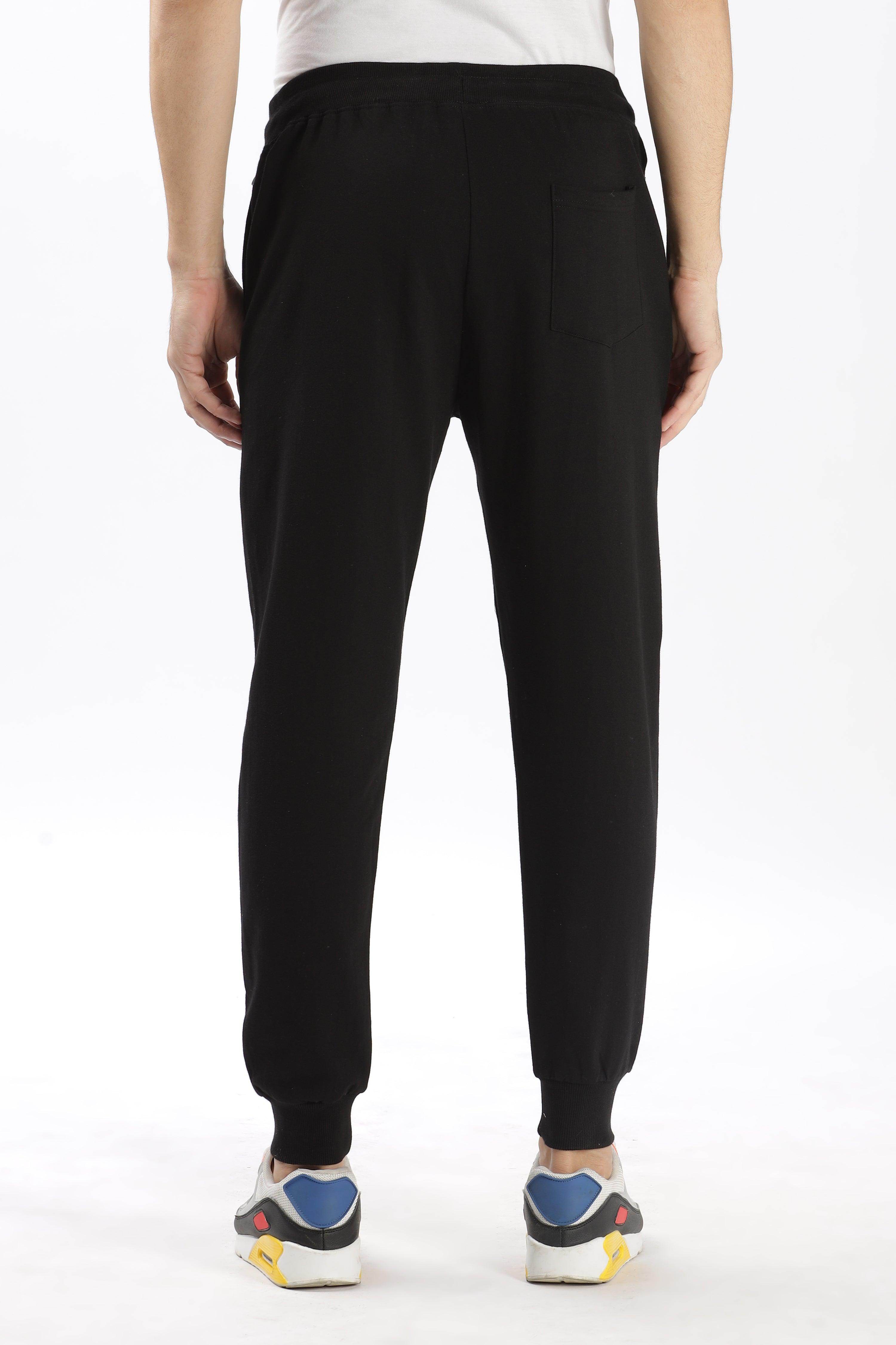 Soulmonk premium black joggers men shown from the back with elastic waistband and cuffed ankles