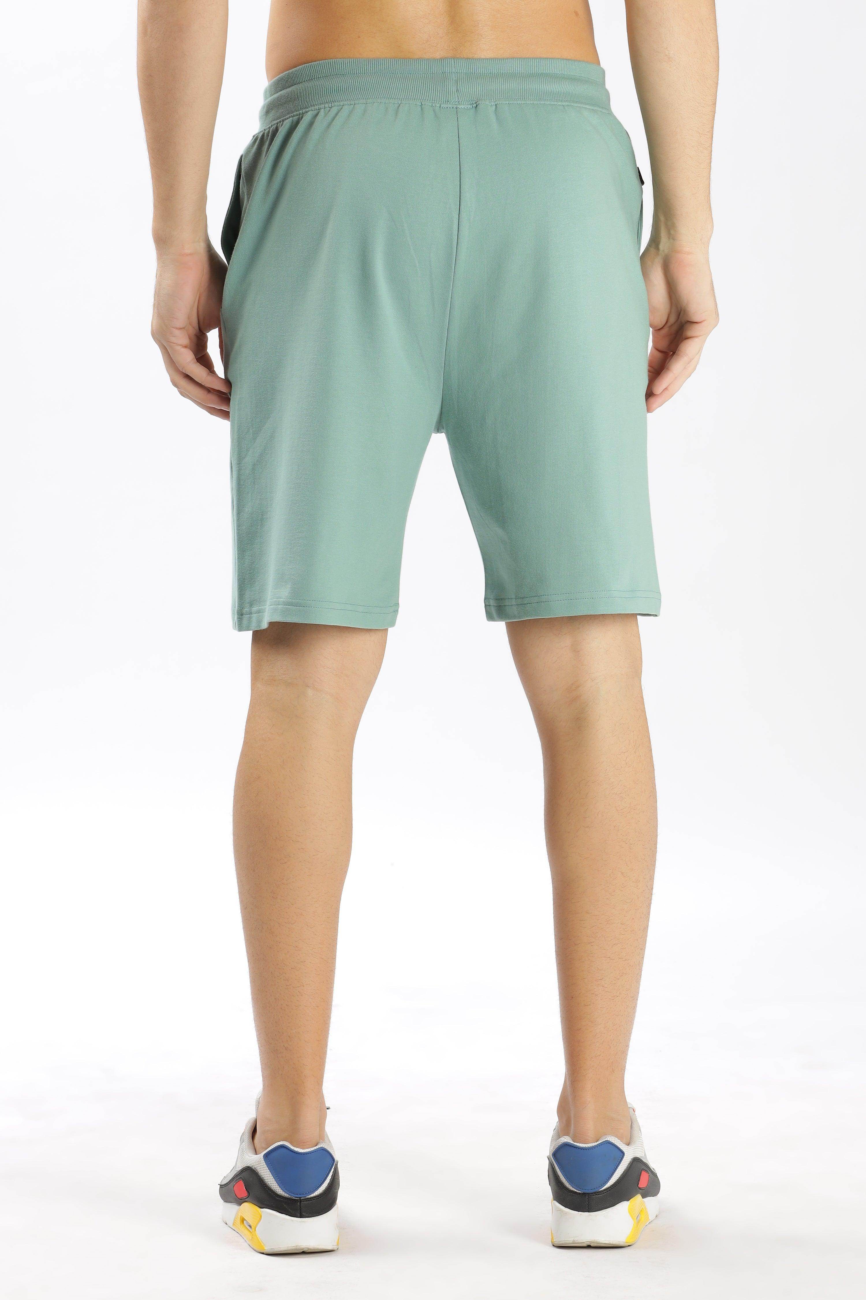 Soulmonk sage green shorts with elastic waistband worn by male model from back
