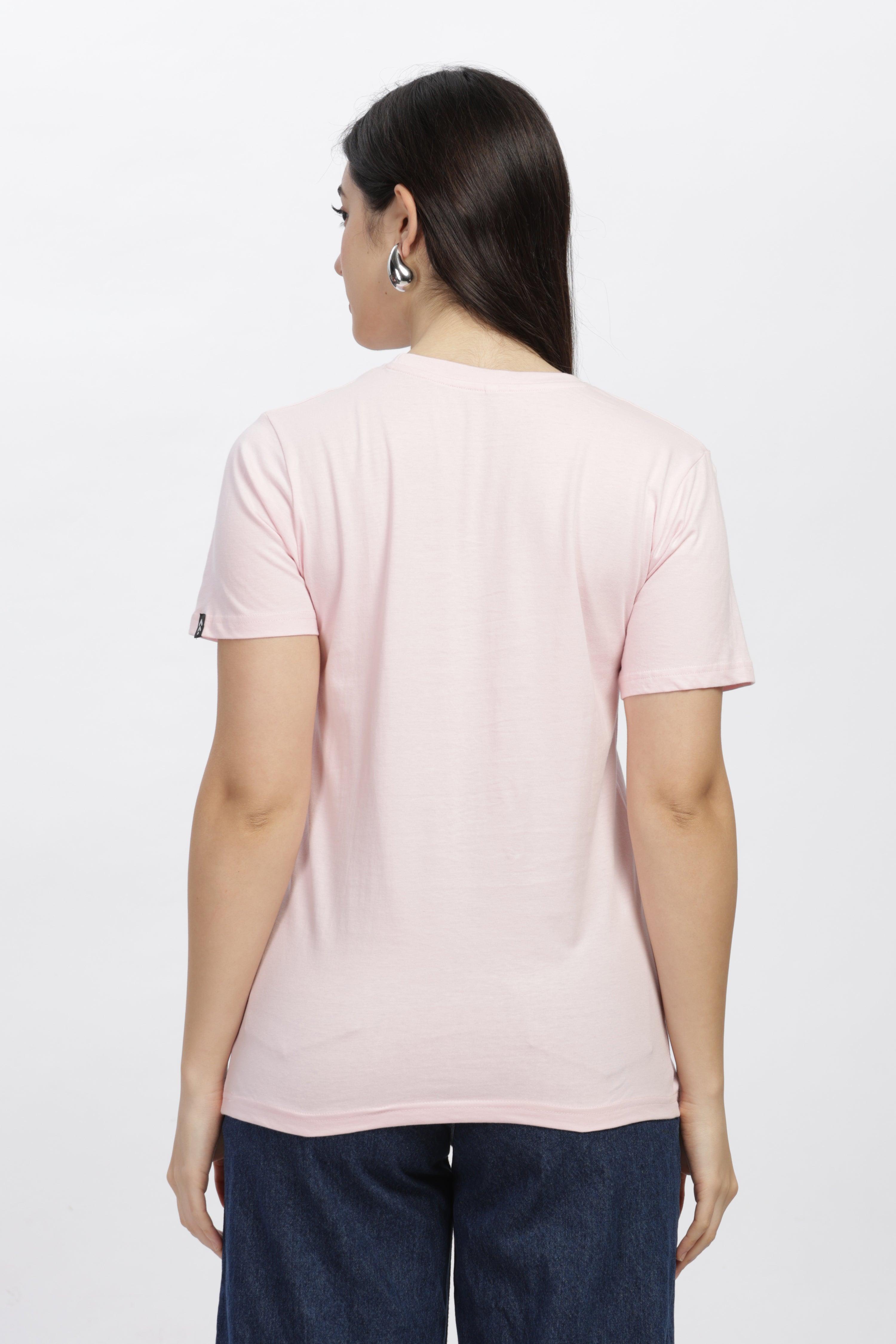 Back view of female wearing soft pink relaxed fit t-shirt with short sleeves and casual style