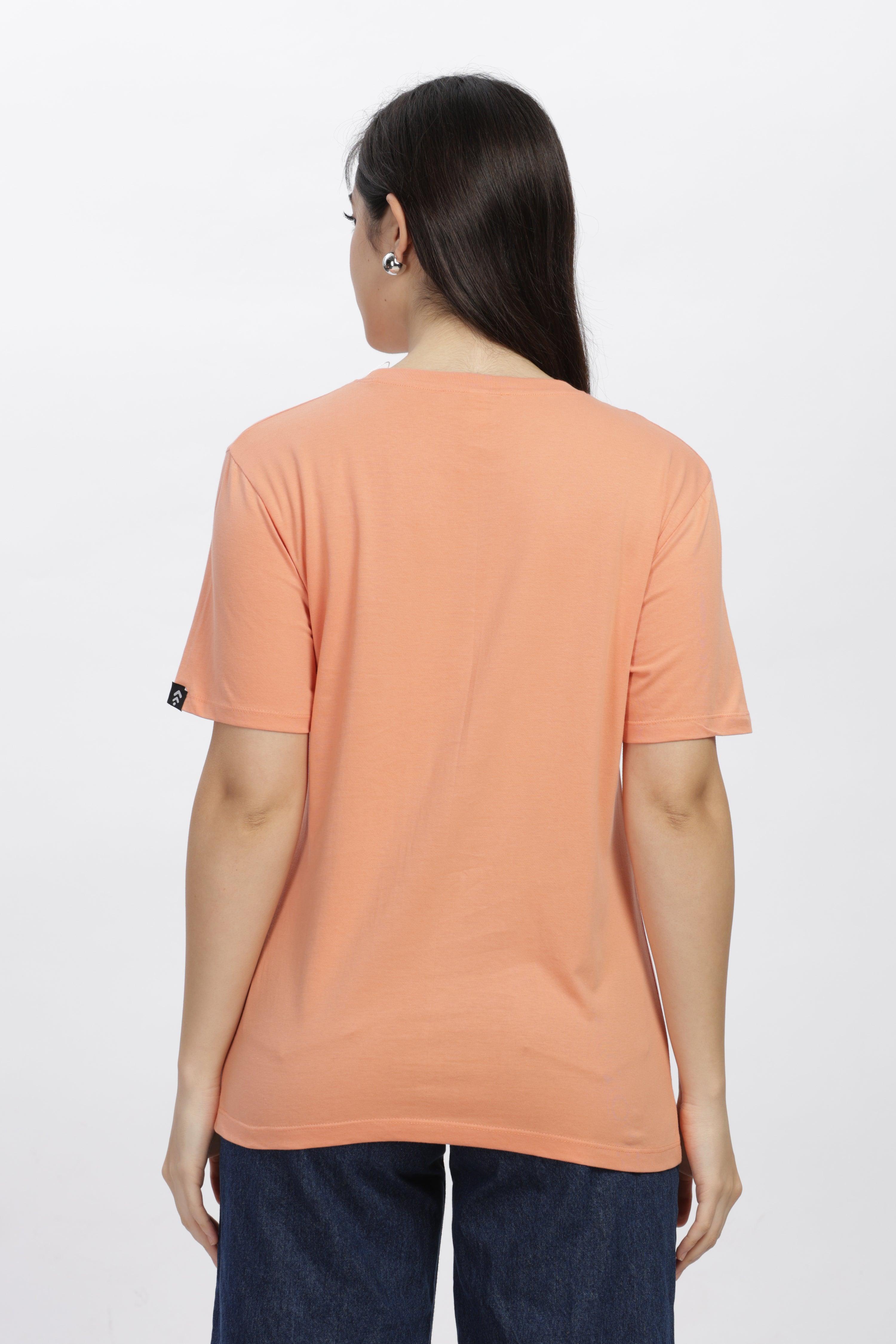 Soulmonk female model wearing sunset relaxed fit t-shirt in soft peach color back view