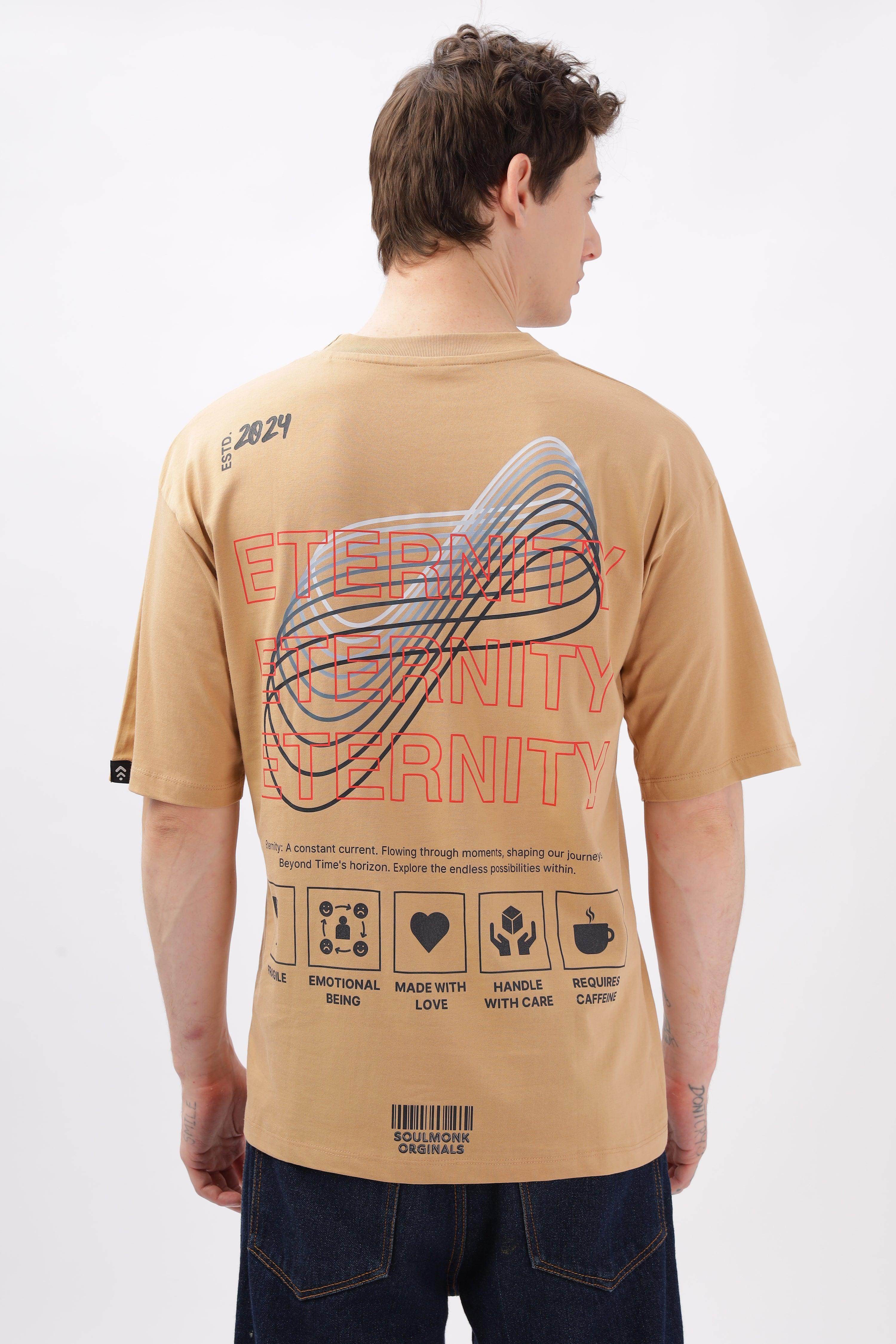 Male model wearing taupe oversized t-shirt by Soulmonk with graphic design on back