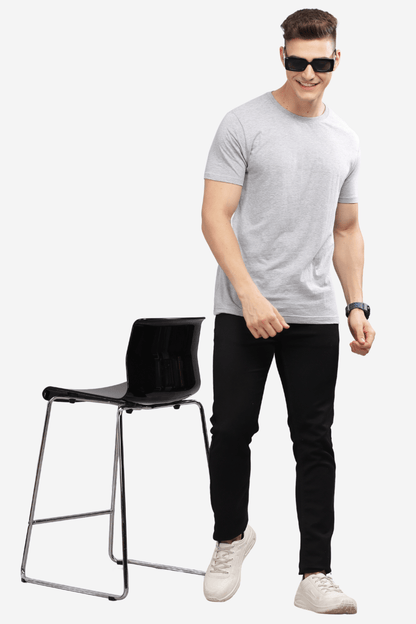 Male model wearing Soulmonk asphalt grey relaxed fit t-shirt with black pants and white sneakers