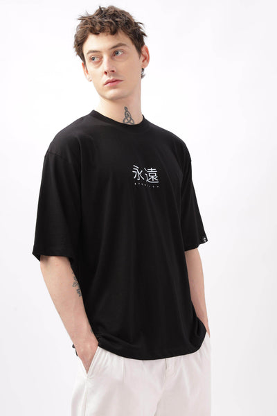 Soulmonk black oversized t-shirt for men with white graphic text worn by male model
