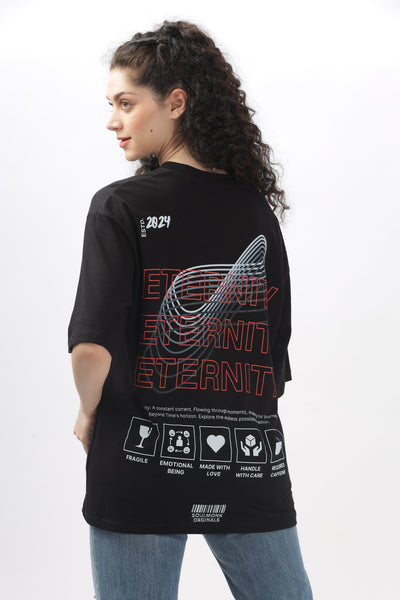 Woman wearing Soulmonk black oversized t-shirt for women with graphic design on the back