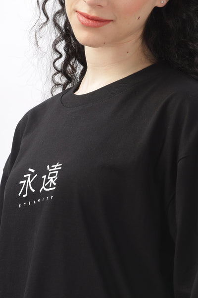 Soulmonk black oversized t-shirt for women with white eternity text and relaxed fit on female model