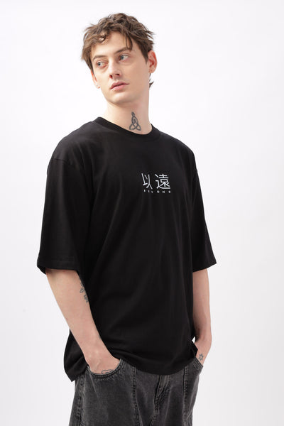 Soulmonk oversized black t-shirt for men with white graphic text worn by male model