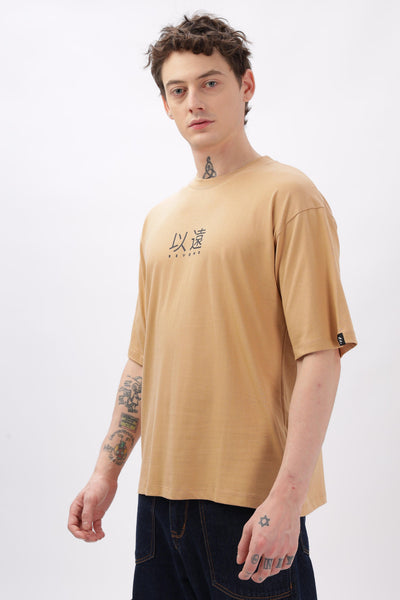 Soulmonk oversized taupe t-shirt worn by male model with short sleeves and printed design