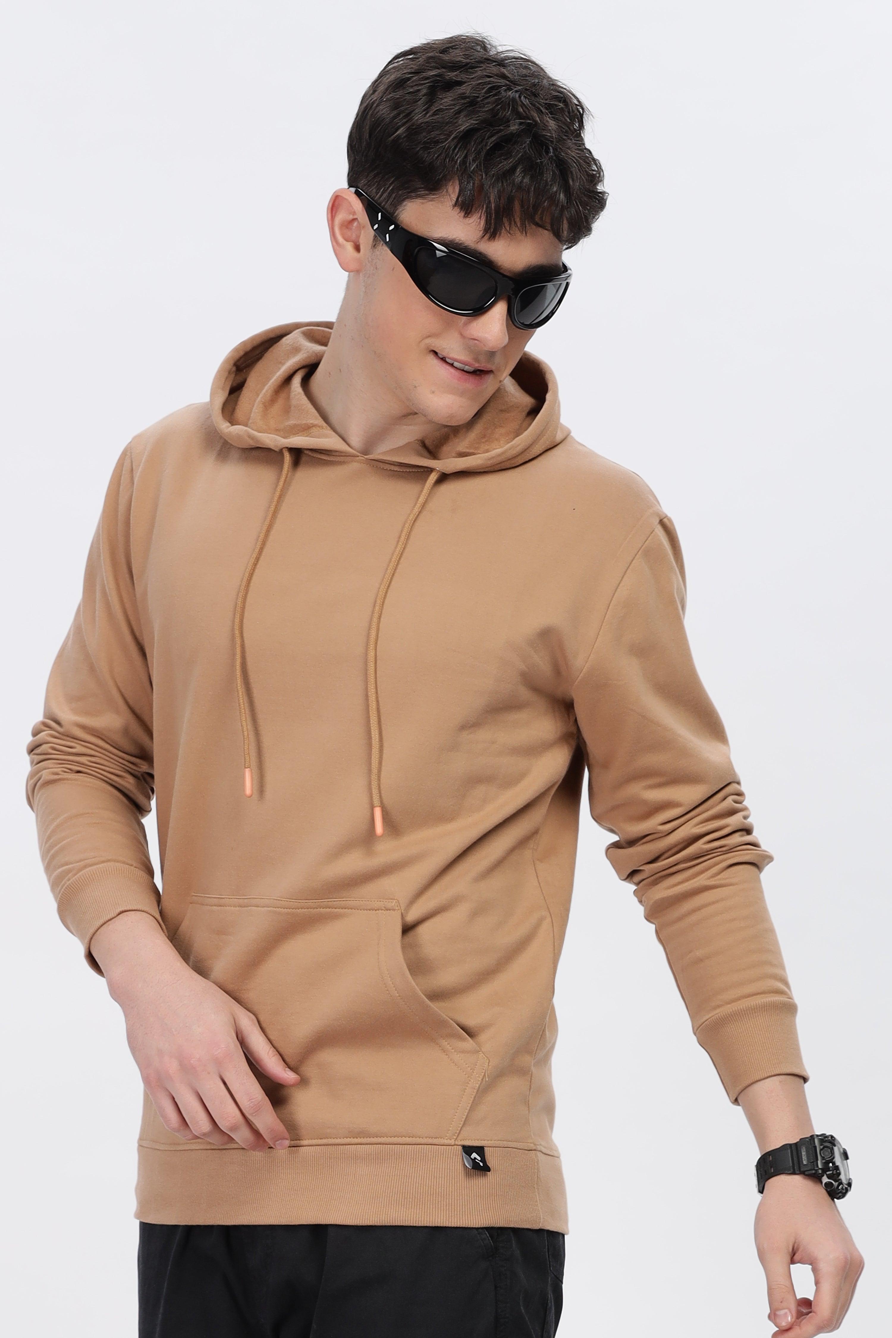 Male model wearing Soulmonk caramel brown hoodie with front pocket and adjustable hood strings