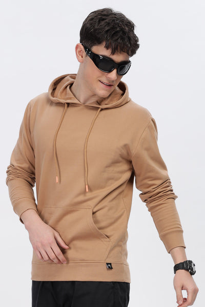 Male model wearing Soulmonk caramel brown hoodie with front pocket and adjustable hood strings