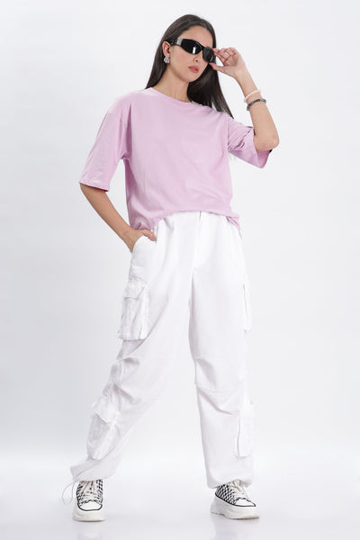 Soulmonk female model wearing lavender oversized t-shirt paired with white cargo pants and sneakers