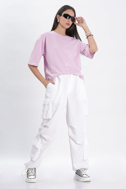 Soulmonk female model wearing lavender oversized t-shirt paired with white cargo pants and sneakers