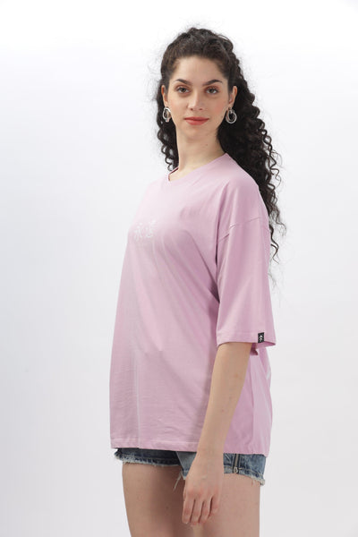 Female model wearing a lavender oversized t-shirt by Soulmonk with short sleeves and relaxed fit