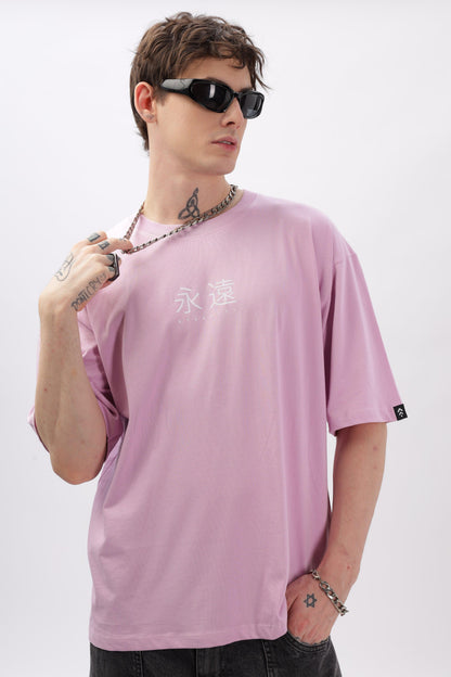 Soulmonk male model wearing lilac oversized t-shirt with white print and black sunglasses