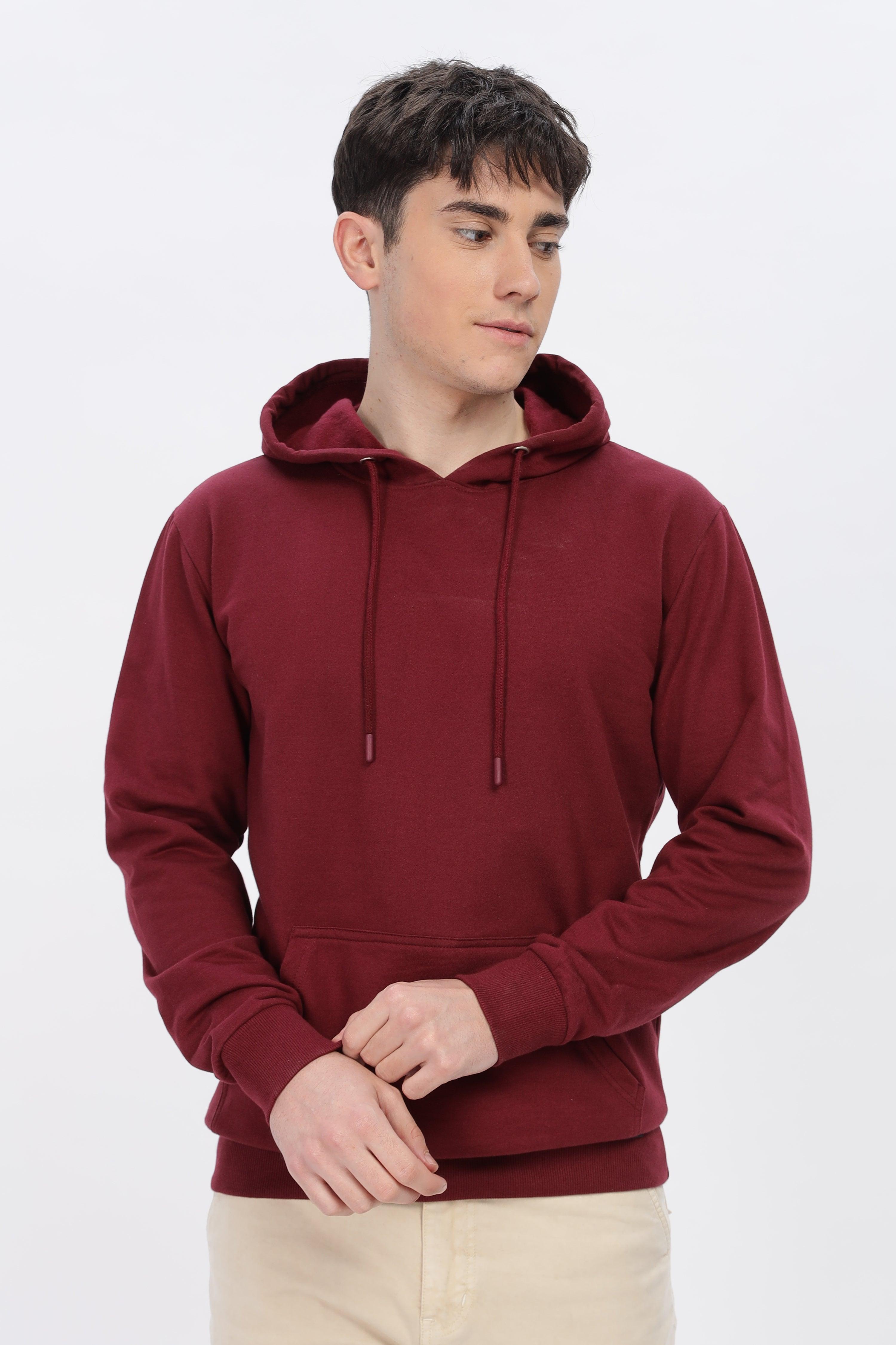 Male model wearing a Soulmonk maroon solid hoodie with front pocket and drawstring hood
