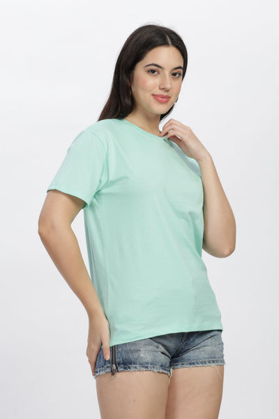 Soulmonk mint green casual t-shirt worn by woman with denim shorts against white background
