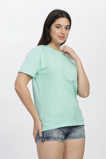 Soulmonk mint green casual t-shirt worn by woman with denim shorts against white background