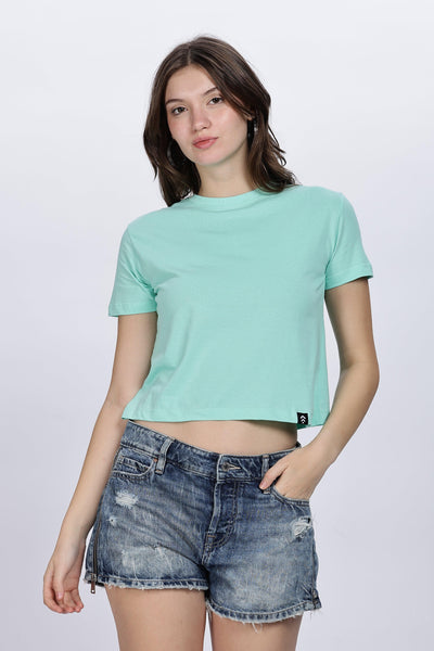 Soulmonk mint green crop top for women paired with distressed denim shorts on female model