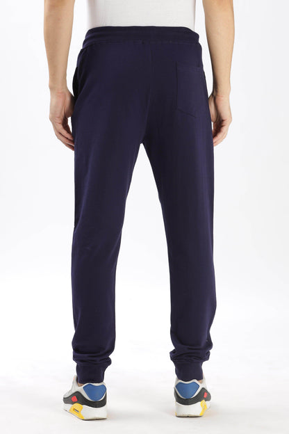 Soulmonk navy blue joggers for men shown from the back with elastic waistband and cuffed ankles