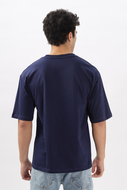 Soulmonk navy blue oversized t-shirt worn by male model showing back view with loose fit