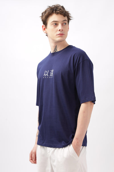 Soulmonk navy blue oversized t-shirt worn by male model with white printed design and short sleeves