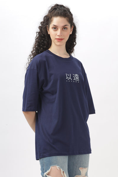 Soulmonk navy blue oversized t-shirt worn by woman paired with ripped jeans