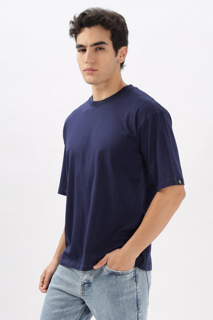 Soulmonk navy blue oversized t-shirt worn by male model with light washed jeans