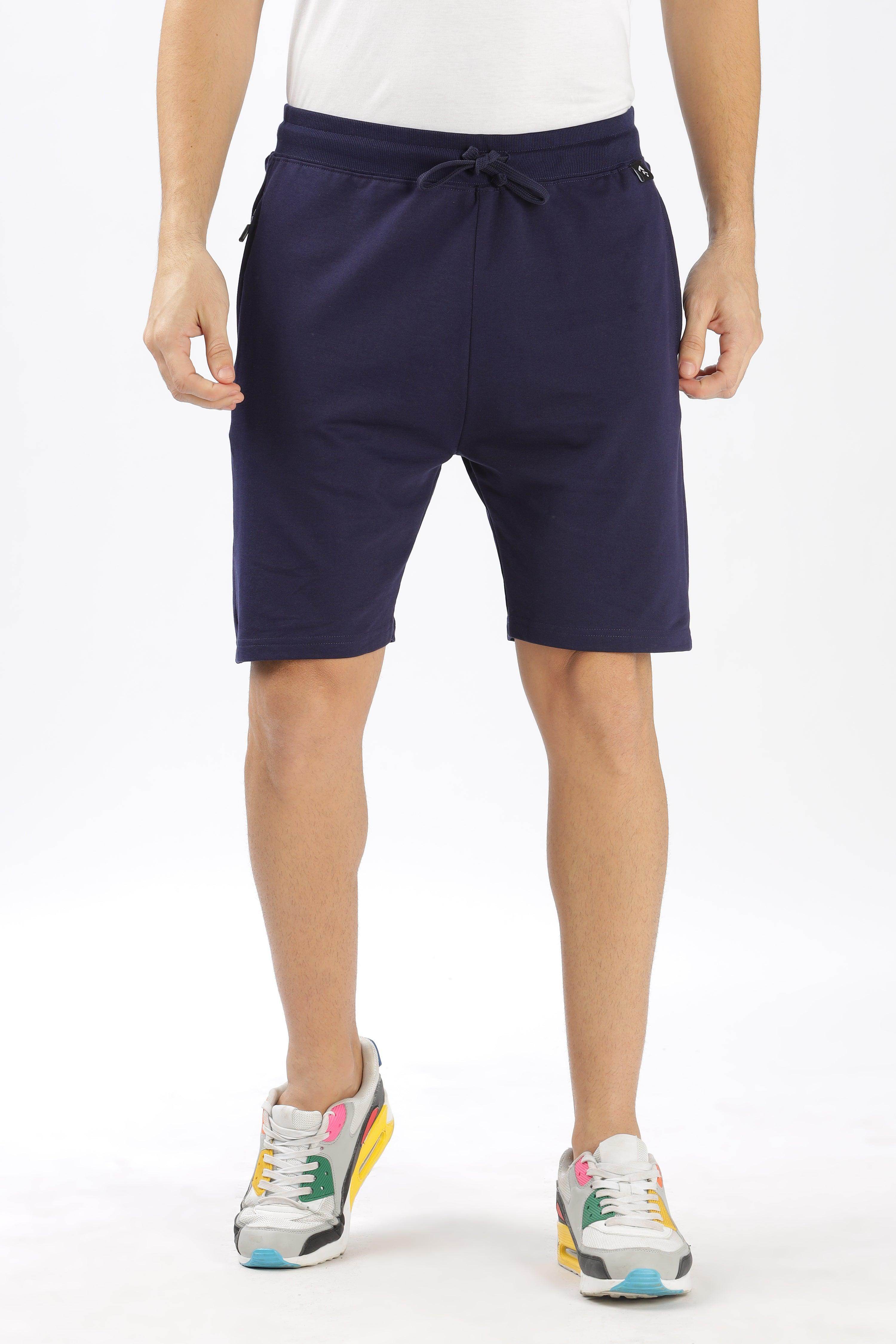SoulMonk navy blue shorts with drawstring waist worn by male model with sneakers