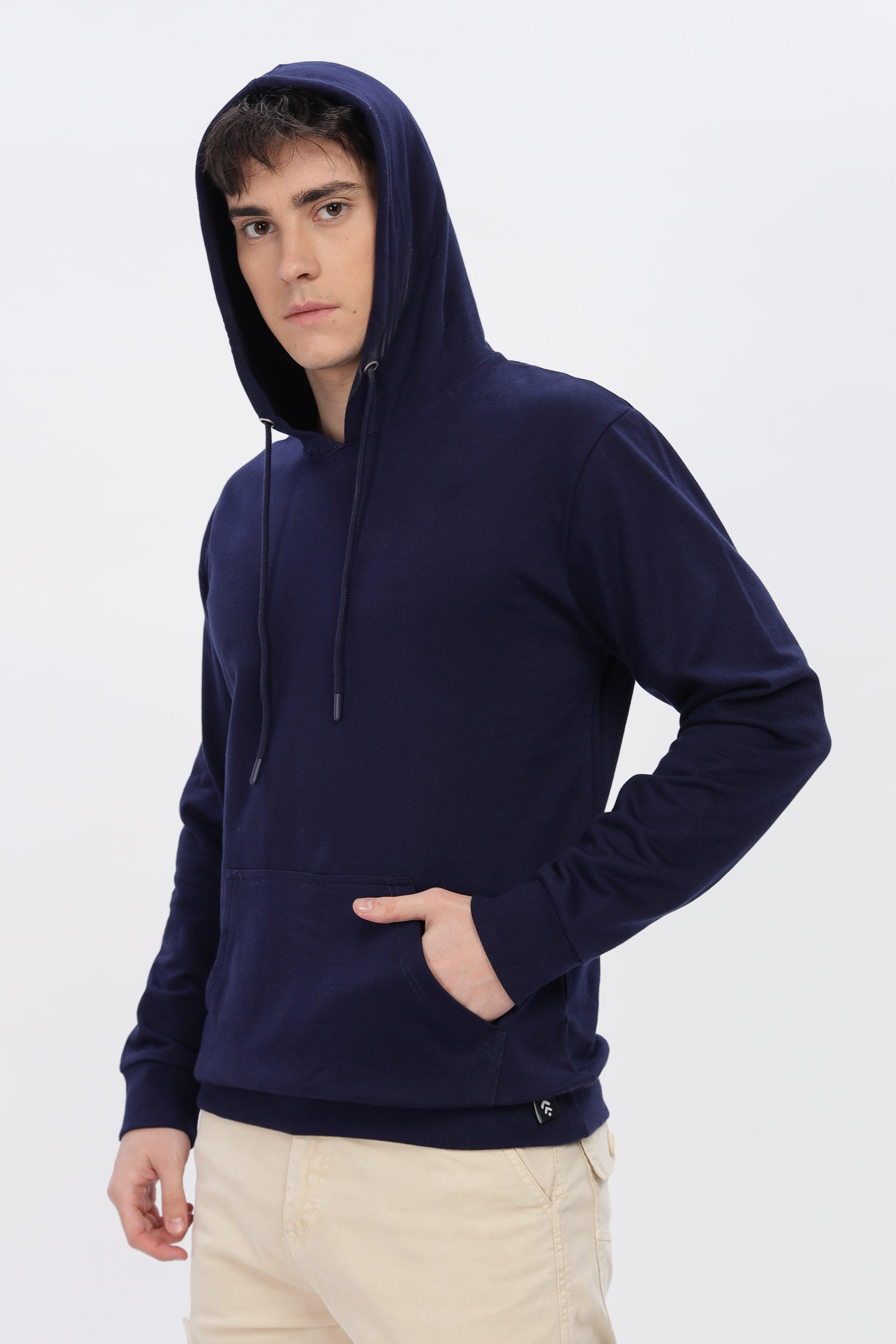 Male model wearing a Soulmonk navy blue solid hoodie with front pocket and hood strings