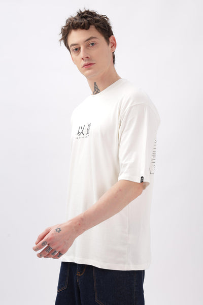 Male model wearing Soulmonk off-white oversized t-shirt with graphic print and half sleeves