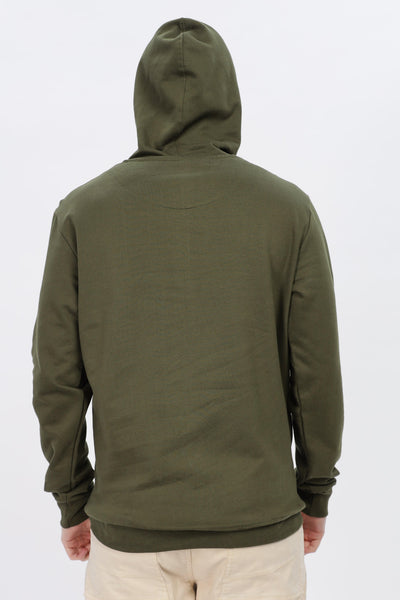 Male model wearing Soulmonk olive green hoodie shown from the back with hood up