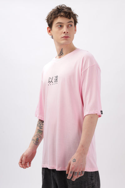 Soulmonk oversized soft pink t-shirt for men with black print modeled by a tattooed male