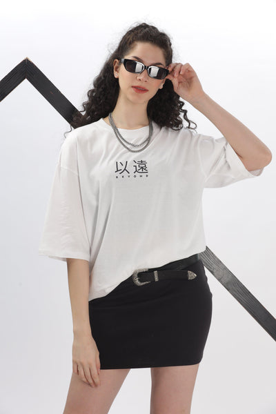 Soulmonk oversized white t-shirt women styled with black skirt and sunglasses