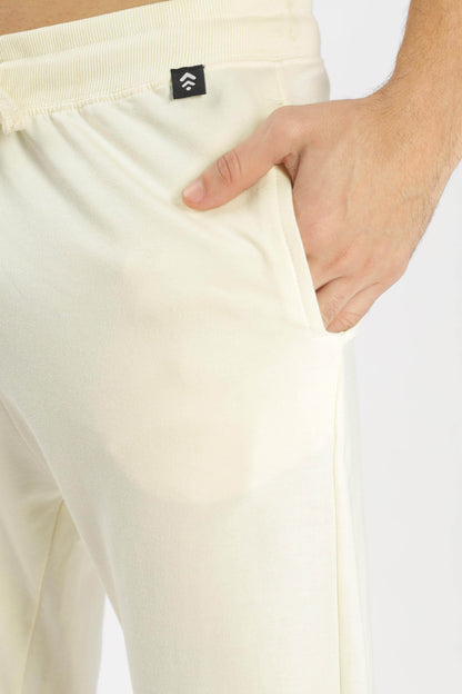 Close-up of Soulmonk pear sorbet joggers pocket with hand inside showing soft fabric texture