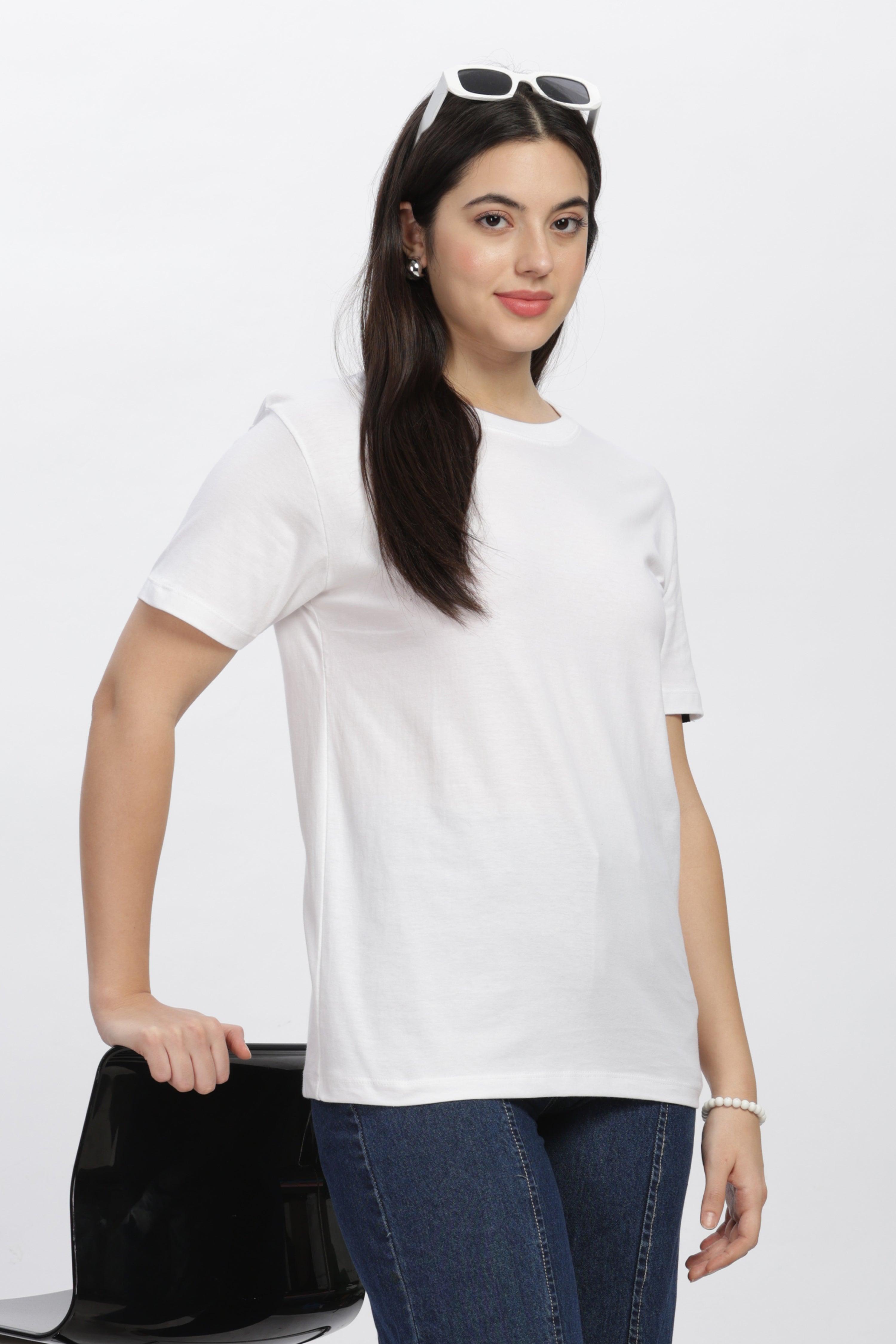 Woman wearing a Soulmonk premium casual white tee paired with blue jeans and white sunglasses