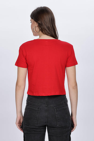 Female model wearing a red solid crop top from Soulmonk, shown from the back with short sleeves