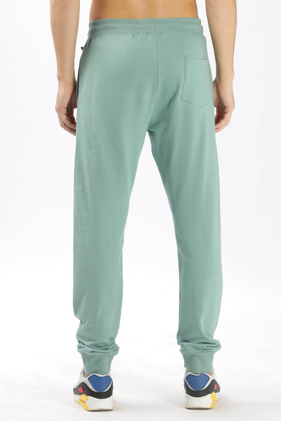 Soulmonk sage green joggers with back pocket and relaxed fit shown from the rear