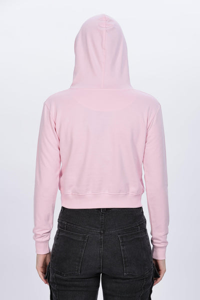 Soulmonk soft pink crop hoodie worn by female model shown from back with black pants
