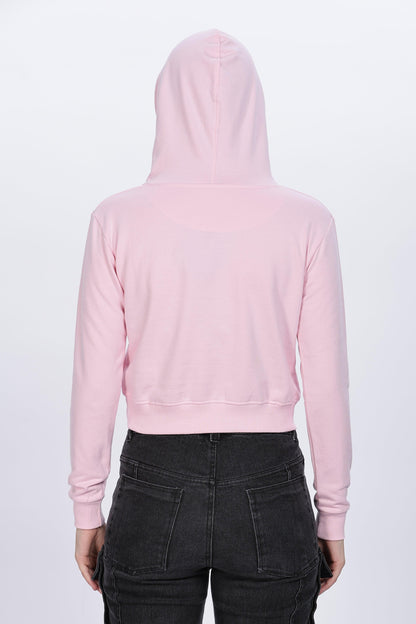 Soulmonk soft pink crop hoodie worn by female model shown from back with black pants