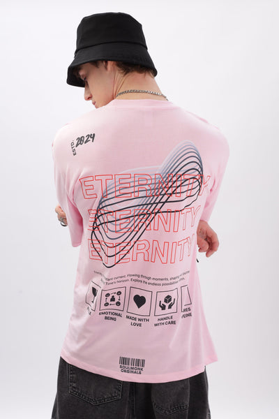 Male model wearing a Soulmonk soft pink oversized t-shirt with graphic back design and black bucket hat