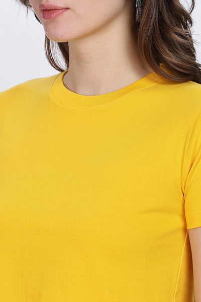 Close-up of female model wearing soft yellow crop top by Soulmonk with round neckline and short sleeves