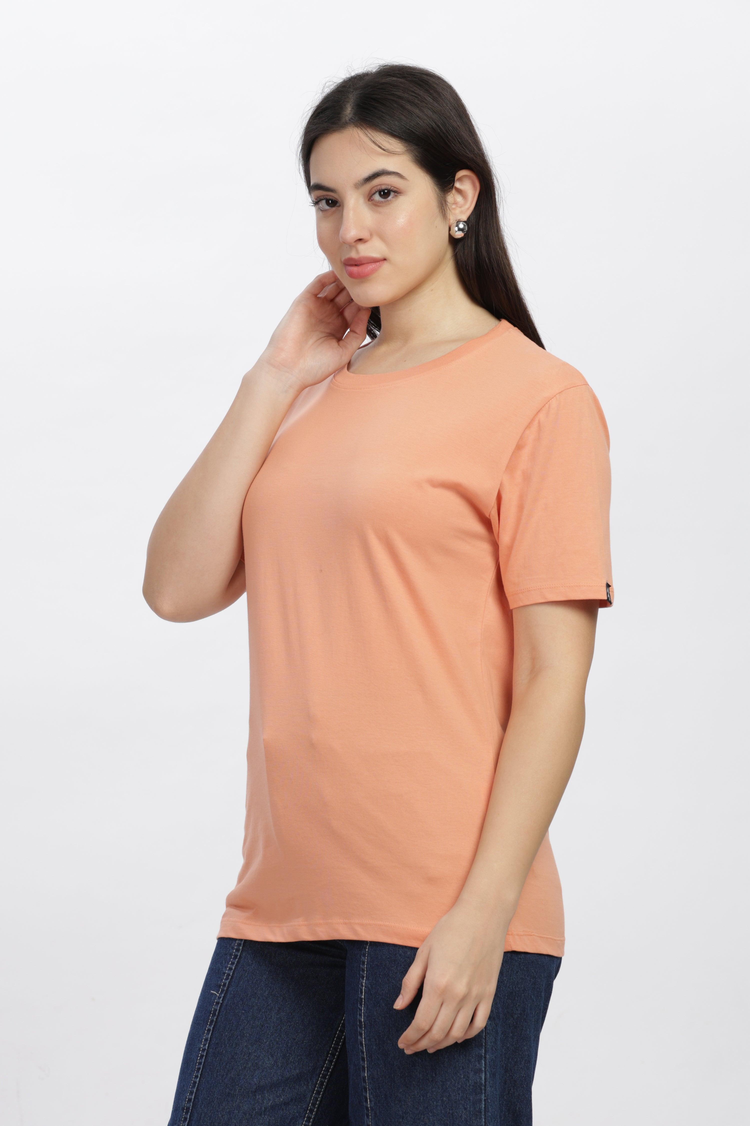 Soulmonk sunset relaxed fit t-shirt worn by woman in orange sunset color with short sleeves and round neck