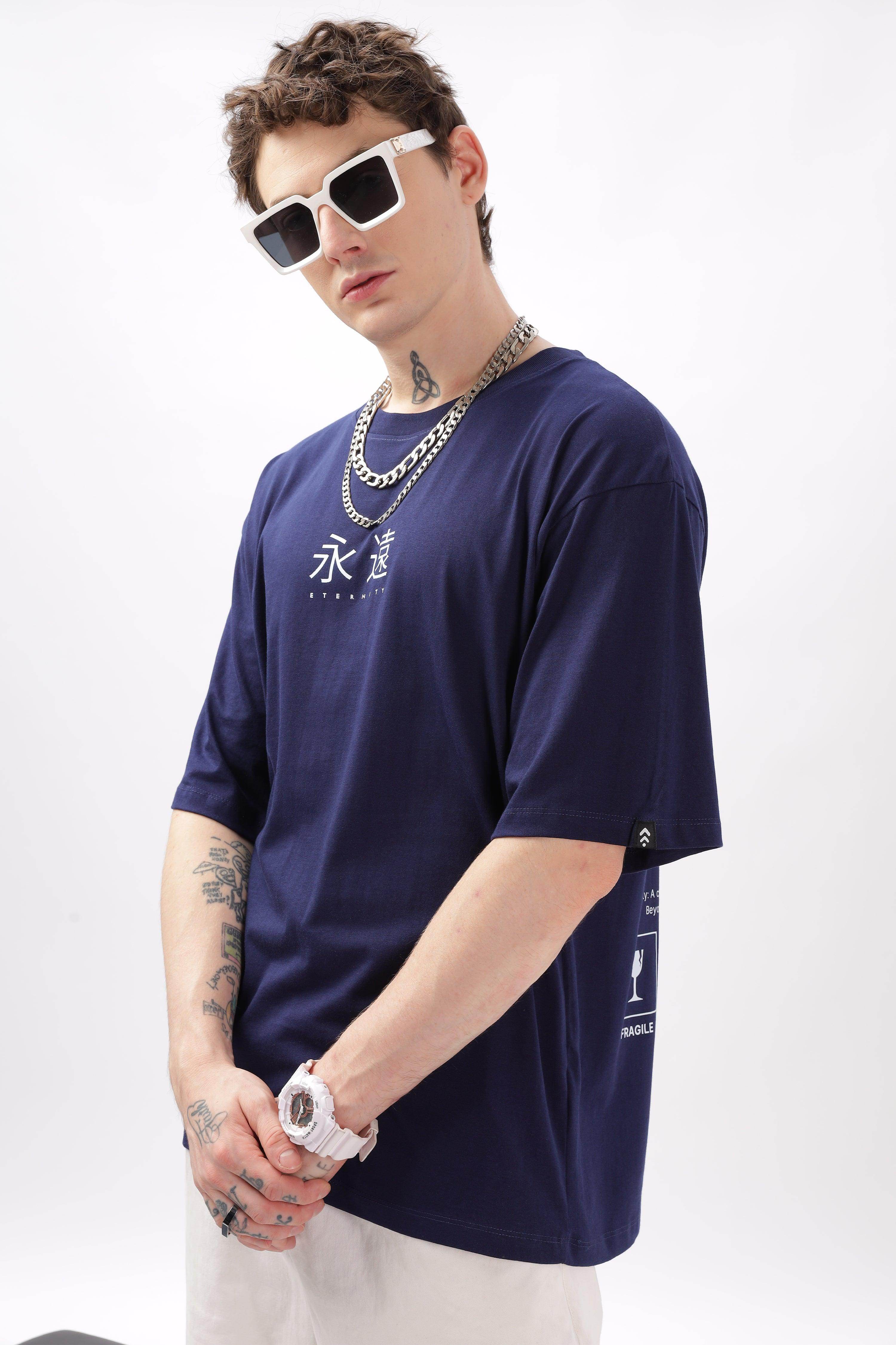 Soulmonk navy blue oversized t-shirt worn by male model with sunglasses and silver chains