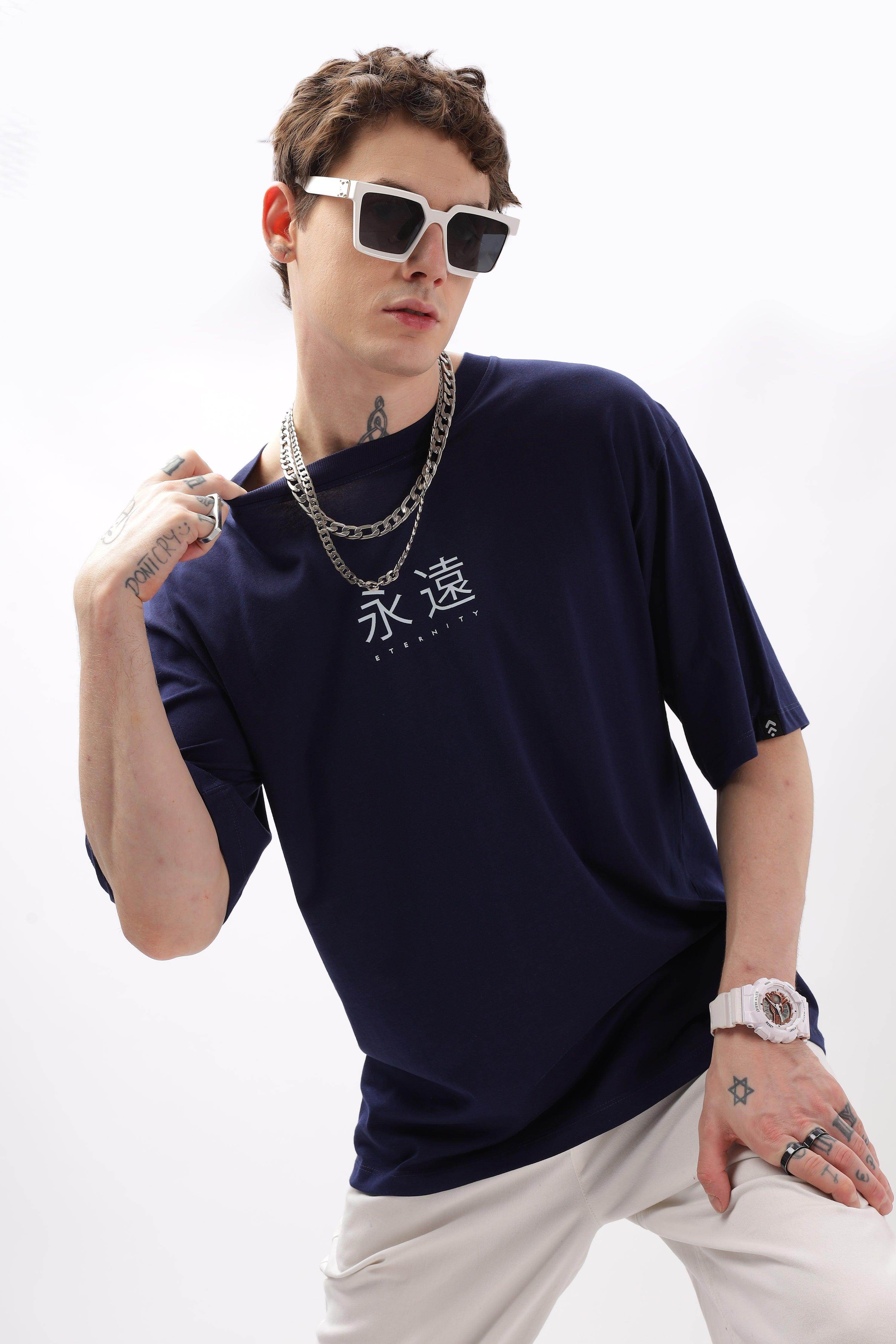 Soulmonk navy blue oversized t-shirt with white printed design worn by male model with sunglasses and chains